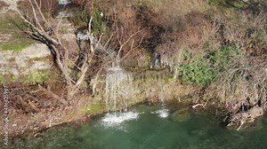 Water pollution - toxic waste disposed into the river. Wastewater with poisonous chemicals from industrial treatment plant pipe dumped into the environment causing aquatic contamination of freshwater