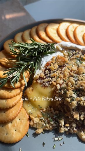 Super Bowl App Idea: Jam Ritz Baked Brie The best part is you can use whatever jam is on hand! Think: fig, apricot, cherry - could even go savory and do onion jam! Whatever! Make this and report back. It’s a good one to have in your back pocket. INGREDIENTS: 8 ounce Brie cheese wheel 2 tablespoons of whatever jam/preserves (I used fig) Coarsely ground pepper 8 @ritzcrackers , crushed, plus more crackers for serving 1 tablespoon olive oil Flaky salt and chopped fresh rosemary, for serving DIRECTI