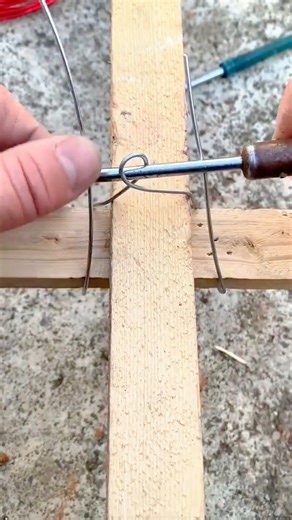 Manually Securing Wooden Lattice Joints With Metal Wire Ties