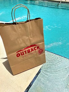 23K views · 198 reactions | POV: You’re relaxing poolside and your best mate surprises you with your favorite order from Outback. What’s in the bag? | Outback Steakhouse - National | Facebook