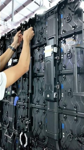 Modular LED screen installation process.#ledscreen #ledvideowall #ledboard #eagerled