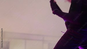 Male playing heavy rock music. Horizontal video with negative space for text. Fast and energetic music. Silhouette of Guitar player with black clothes