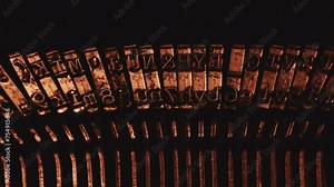 Close up of vintage typewriter letters and symbols with golden light. Antique Typewriter