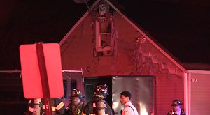 6 displaced after garage fire spreads to neighbors house, causes brush fire