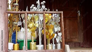 Traditional Buddhist decoration - golden and silver Bodhi Tree - Buddhist tree, on the balcony Buddhist temple, The Vat Phramahathat Rajbovoravihane Luang Prabang, Laos.