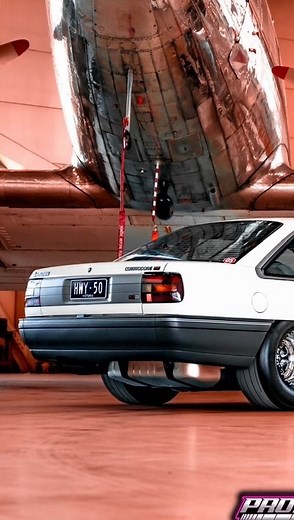 Prostreet Media // Jesse Bonnici on Instagram: "BT1 Airlines clear for takeoff ✈️ BEHIND THE SCENES I would never have thought I would see the day a VN would be parked next to a plane but here it is. Andrews VN BT1 is not your average Ex Chaser, [HWY-50] is one of a kind, Under the bonnet is a Flowcraft Forged 304ci suited for the Harrop 2650i Blower A built auto and 4600 Stall Converter helps drive the power to the rear-end which has been tubbed to accommodate 15x10 Weld V-Series wheels wrapped