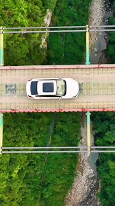 9.9K views · 296 reactions | The amazing 300-meter-high cable bridge in Wulong District has been regarded as an engineering masterpiece. It is constructed in the mountain city with one of, if not the, most complicated terrain conditions. Courtesy to Zhou Neng #Chongqing #重庆 #drone #bridge #cityscape #megastructure | iChongqing | Facebook