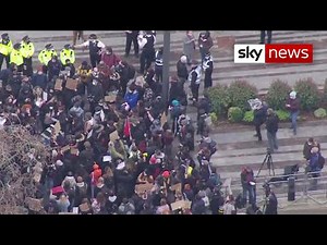 Protesters gather outside Scotland Yard following clashes with police