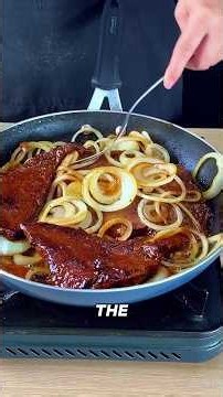 ​How to prepare tender beef steak with abundant caramelized onions in a skillet for dinner #food
