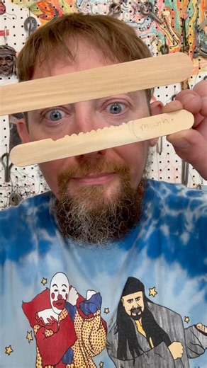 Homemade Scratchamore Jaw Harp made with of Popsicle Sticks.