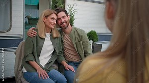 Hugging parents mother and father listening unrecognizable child girl kid daughter tell poem singing song standing back view baby talk speak talking telling speaking Caucasian mam and dad applauding