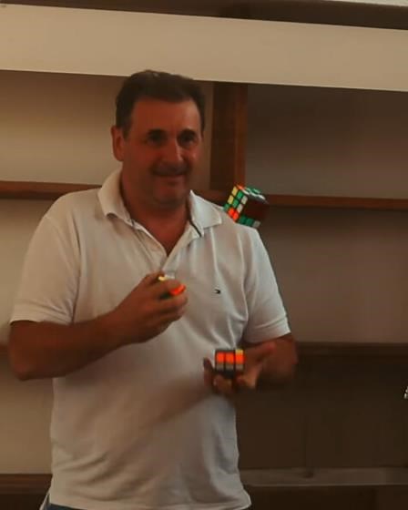 He Solves 3 Rubiks Cubes While Juggling!!