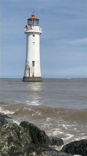 Lighthouse at high tide. New Brighton beach