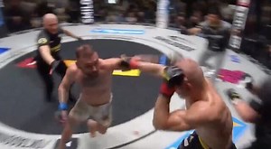 Crashed Out: MMA Fighter Gets Punched Out The Cage After He Kissed And Humped His Opponent!
