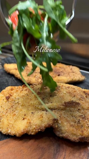 Easy chicken milanese with arugula salad. This chicken Milanese recipe is the perfect quick dinner. A deliciously breaded chicken cutlet, topped with a bright, citrusy arugula salad and freshly shaved parmesan. A light and flavorful chicken dish!This can be made quickly and paired with so many sides! My favorite way to enjoy chicken Milanese is with a bright arugula salad piled on top and a side of creamy mashed potatoes.Notes:I like to place my chicken between two pieces of plastic wrap before 