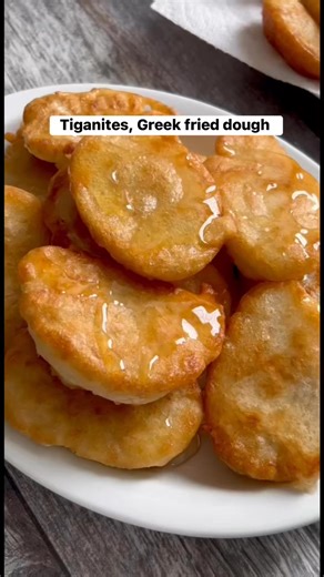 We love TIGANITES, the traditional Greek fried dough from our parents’ region in Greece 🇬🇷. Greek tiganites are shaped like small pancakes and they are fried until golden brown and usually served with a drizzle of honey. These are often served for breakfast or as a snack. Full recipe: https://miakouppa.com/tiganites/ | Mia Kouppa