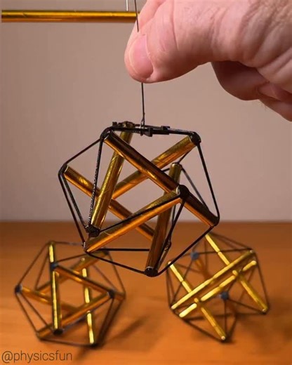 Tensegrity Icosahedron Ornament Kit: make the famous tensegrity icosahedron inverted by the architect Buckminster Fuller out of gold paper straws and specially designed 3D printed elastic connectors. Six struts (three parallel pairs) float isolated from each other but held in a stable configuration by a net of 24 connecting tendons. A fun DIY design by Tensegrity Adventures (kit makes six ornaments) ➡️ Follow the link in my profile for info on where to get this kit and other amazing items featur