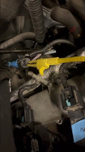 Back probing an oxygen sensor on a Chevy Equinox