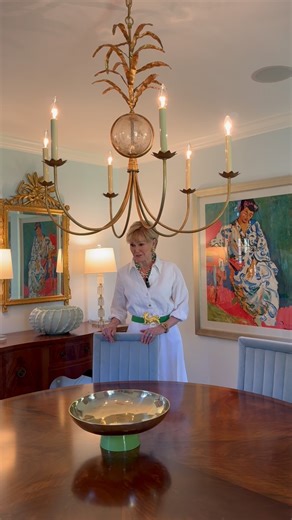 Previews Interiors by Sally Draughon on Instagram: "Welcome to this inviting dining room! With a square layout, Sally chose a square rug to ground the space and paired it with a round table for contrast. The velvet blue chairs, accented with acrylic and brass, add a modern touch, while the rug, artwork, and curtains tie the palette together beautifully. 🩵 #PreviewsInteriors #SallysStyle #DiningRoomDesign #VelvetChairs #InteriorInspo #SouthernCharm"