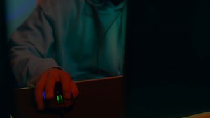 A young gamer moves the mouse with skill while playing in front of the computer monitor - Free Stock Video