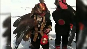 Chinese Kazakh eagle hunters let their birds show off their hunting