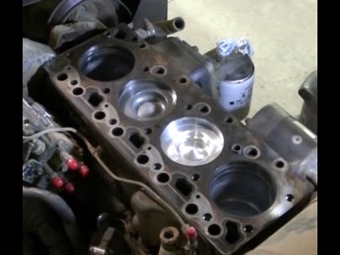 Versatile 276 3.9 Cummins 4BTA "Installing Pistons, Rods, Oil Pan and Oil Cooler"