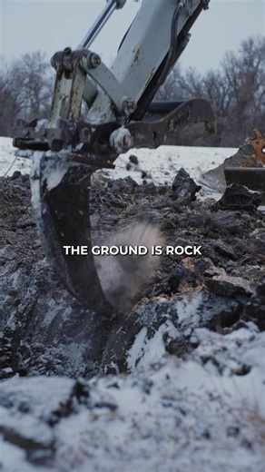 Don’t fear the ripper ⛏️🥶 When you’re working with frozen ground, a frost ripper is essential. Up here in Manitoba, the ground is rock solid. The ripper let's us make a scratch hole so the drill bit can get into that thawed dirt. Now that we've got the hole, it’s smooth sailing. GET AFTER IT! 🔥 #bluecollar #winter #excavator #getafterit #ripper