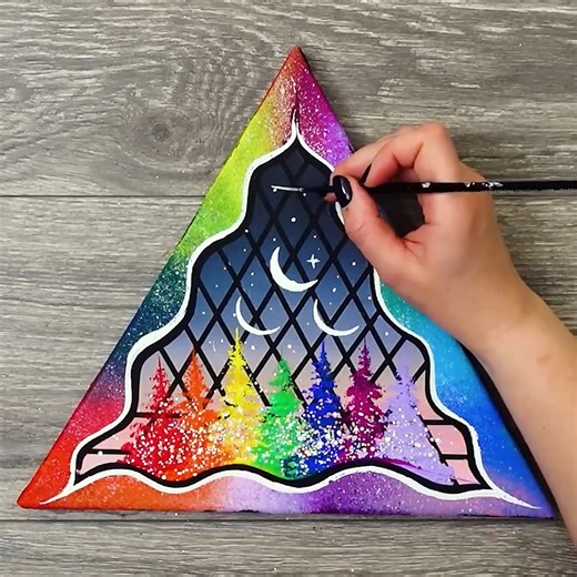 Magic Hands on Instagram: "🌈 Triple Moon Triangle 🌙✨ | Glitter Acrylic Painting Tutorial | MagicHands 🎨 Welcome to MagicHands! 🎨💫 In this video, we’ll create a stunning triangle-shaped acrylic painting full of color, sparkle, and magic! 🌈✨ The borders are painted in beautiful gradient tones with glitter that shimmer like colorful clouds 🌤️💖. Inside the triangle, you’ll discover trees in matching rainbow shades, sparkling in harmony with the borders 🌳🌟. At the center, three glowing moon