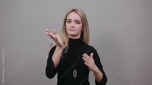 Time out gesture, break, doing t symbol or sign with help of hands. Young attractive woman, dressed black sweater with green eyes, blonde hair, background