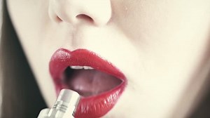 Closeup of woman smoking electronic cigarette