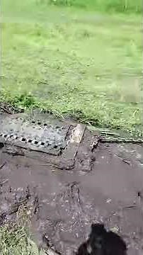 Cleaning ditches, homemade ditch tool towed by lawnmower