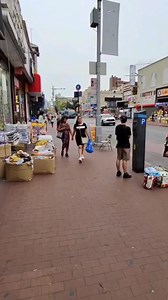 Strolling three blocks along Jamaica Avenue, Queens, New York City, from 168th Street to 165th Street. Jamaica Avenue is a major thoroughfare in New York City, specifically in the boroughs of Brooklyn and Queens. It's known for its bustling commercial activity, with numerous stores, restaurants, and a significant transportation hub. The avenue extends from East New York Avenue in Brooklyn to Jamaica Estates in Queens, and is a popular destination for shopping and dining. Location: Jamaica Avenue