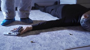 The forensic scientist finds and marks the evidence at the crime scene. Forensic expert who marks items that can be used as evidence at the crime scene.