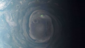 A flash of green: NASA's Juno spacecraft captures image of lightning on Jupiter