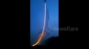 Amazing ladder of fireworks rises into sky