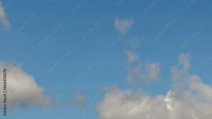 Floating clouds. Time-lapse recording. A looped clip with no breaks. 4K, Ultra HD, UHD