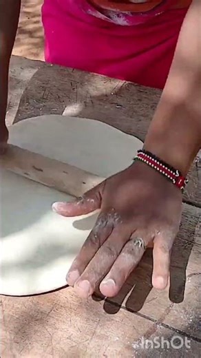 African woman cooking for her kids