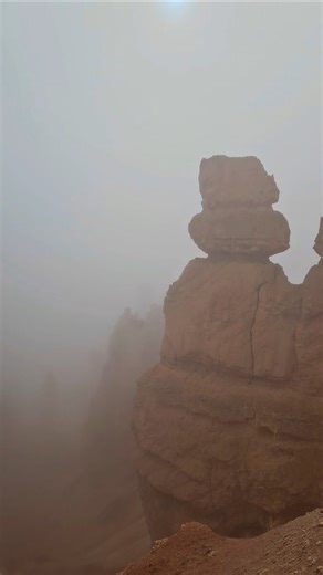 Hiking Queen's Garden Trail in Bryce, Utah as the fog roll into the canyon.