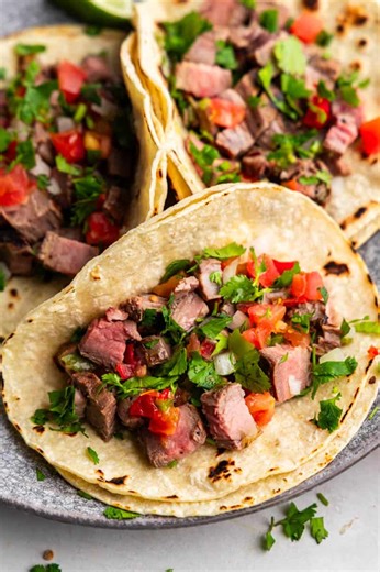 These easy steak tacos are ready in just 35 minutes with no marinating required. Cook it up on the grill or on the stovetop. https://thestayathomechef.com/carne-asada-tacos/ | The Stay At Home Chef