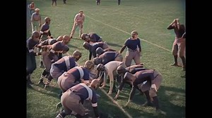 Circa 1927 - in this silent comedy, football players accidentally step on a player's head during tackling. he gets up, very dizzy.