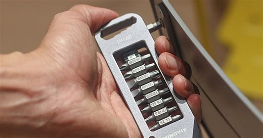 Magnetic multitool screwdriver stores bits in its belly