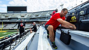 Volunteers install thousands of Kinnick Stadium seatbacks ahead of Hawkeyes' home opener