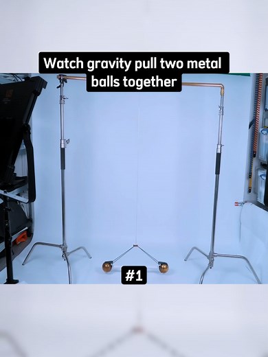 Explore Gravity's Pull on Two Metal Balls