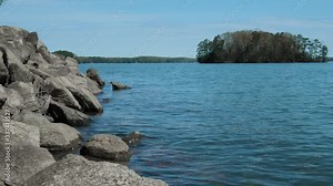 Amphibolite Metamorphic Rock Bed on Lake with Island in Background