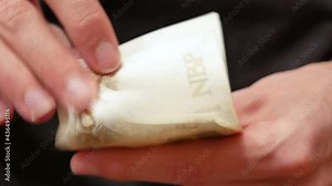 Man counting polish money, holding a set of 200 PLN bills in hands, pln, polish zloty banknotes count, front view, closeup. 200 złotych, two hundred zloty, wage, pay day, paycheck, currency exchange
