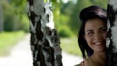 Smiling young attractive woman very beautiful face portrait in park,...