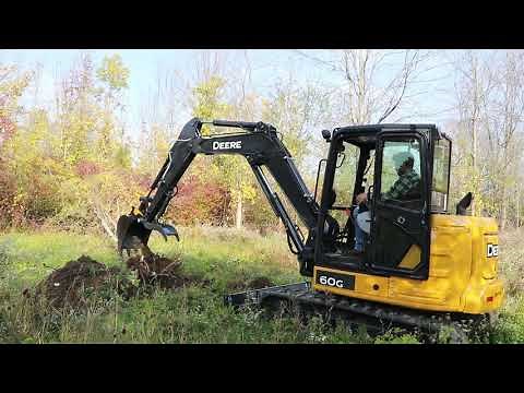 Deere 60G Excavator Fueling Up & Knocking Trees Over