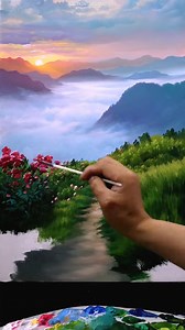 "Tranquil Landscapes: The Serenity of Oil on Canvas" This breathtaking oil painting by artist Zeng beautifully captures the essence of nature's tranquility. The artwork immerses the viewer in a serene mountain landscape where lush green fields blend harmoniously with the morning mist rolling over the hills. A vibrant burst of red flowers in the foreground adds a striking contrast, while the pathway reflecting the sky hints at a calm, flowing stream. The soft pastel hues of the sunrise create a m