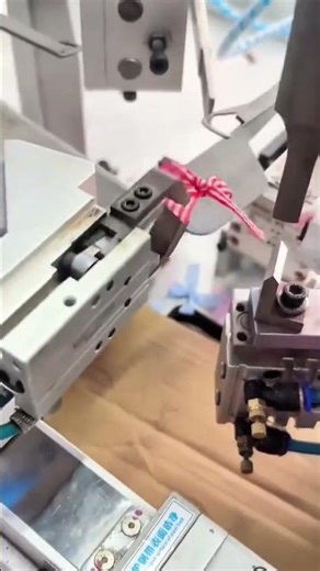 Automatic ribbon bow making machine efficiently producing checkered decorative bows for gift packagi