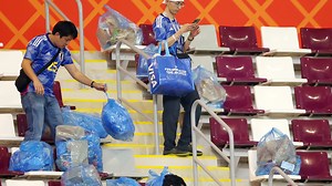 Japan fans clean up on and off the pitch as they tidy stadium after famous win